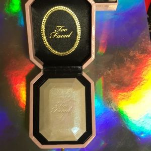 Too faced diamond light multi use highlighter.